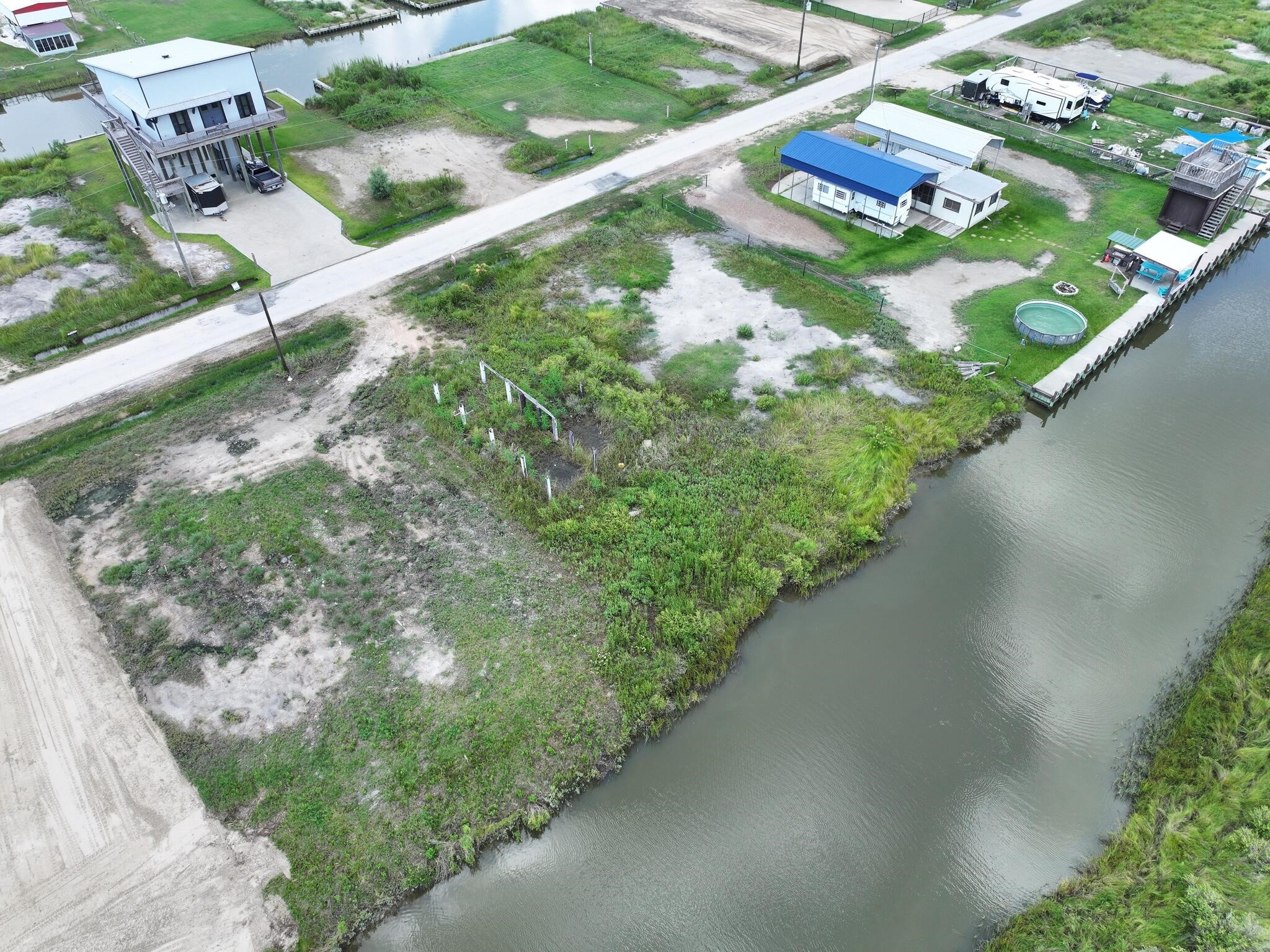1392 Mabry Port Bolivar, TX 77650 - Photo 11 of 25 a view of a garden with a lake