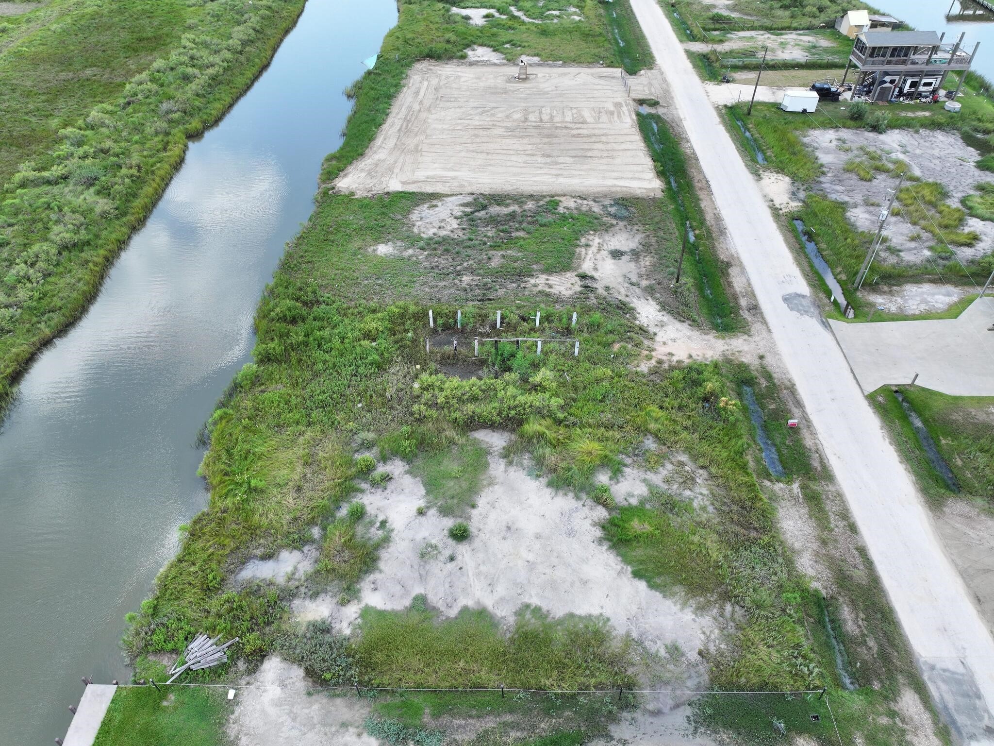 1392 Mabry Port Bolivar, TX 77650 - Photo 14 of 25 a backyard of a house with lots of green space