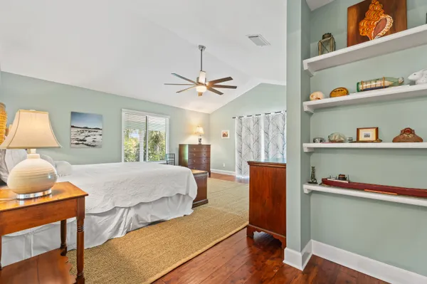 a view of staircase with white walls and a window