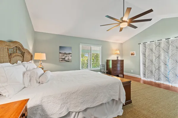 a bedroom with two beds and a window