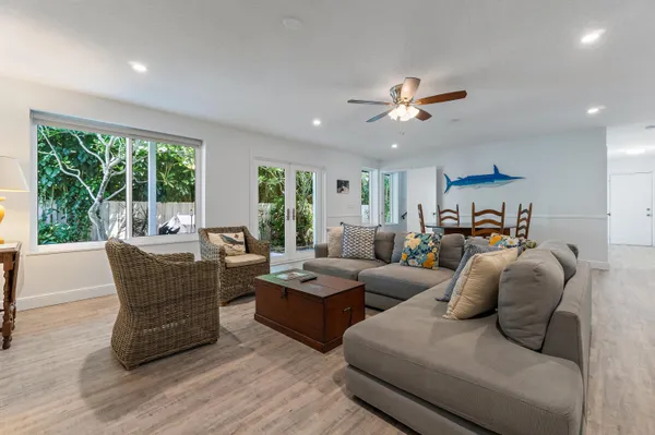 a view of a porch with chairs and backyard