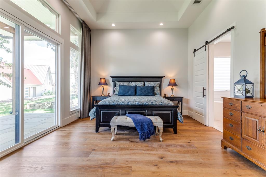 1757 Country Club Road Bowie, TX 76230 - Photo 15 of 40 a bedroom with furniture and wooden floor