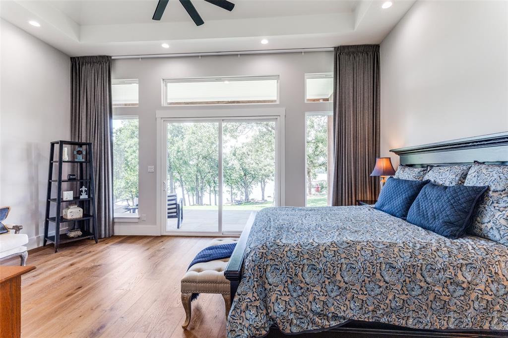 1757 Country Club Road Bowie, TX 76230 - Photo 16 of 40 a bedroom with a large bed and a large window