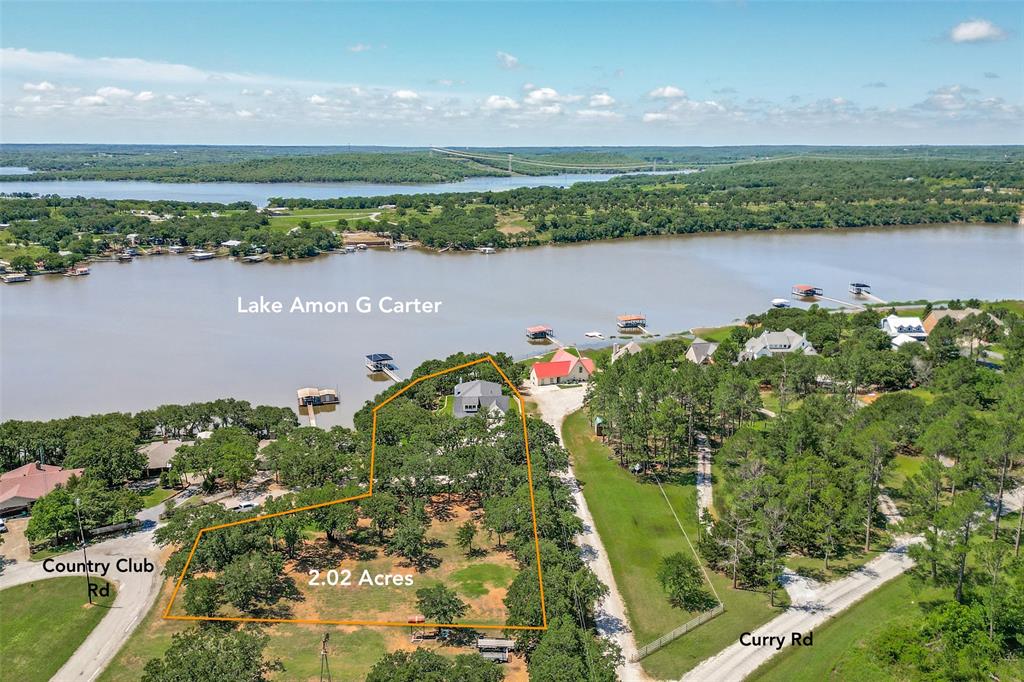 1757 Country Club Road Bowie, TX 76230 - Photo 3 of 40 a view of a lake with a city