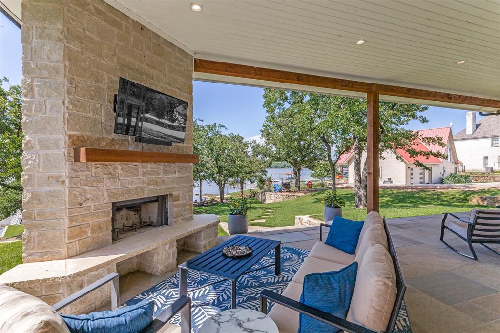 1757 Country Club Road Bowie, TX 76230 - Photo 32 of 40 a outdoor space with patio the couches and a fireplace