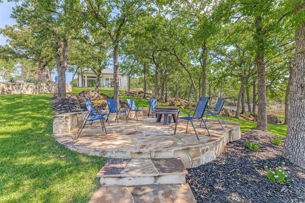 1757 Country Club Road Bowie, TX 76230 - Photo 36 of 40 a view of a backyard with sitting area