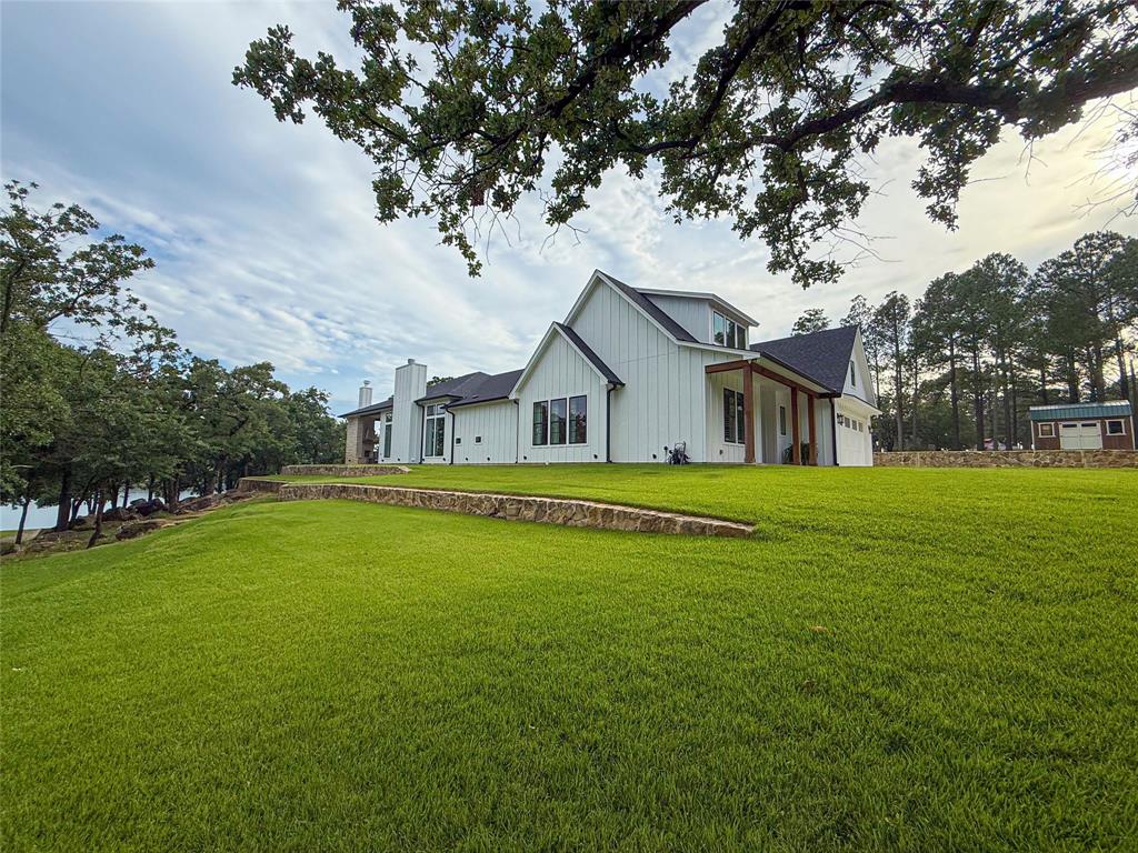 1757 Country Club Road Bowie, TX 76230 - Photo 37 of 40 a front view of house with yard and green space