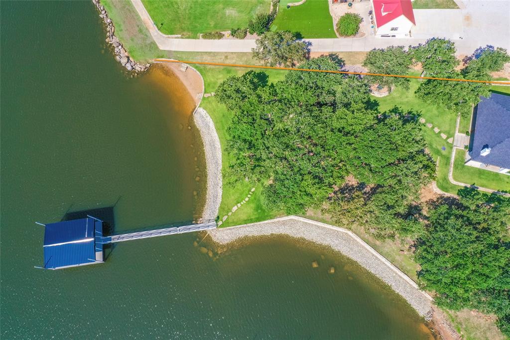 1757 Country Club Road Bowie, TX 76230 - Photo 39 of 40 a view of a pool with a yard