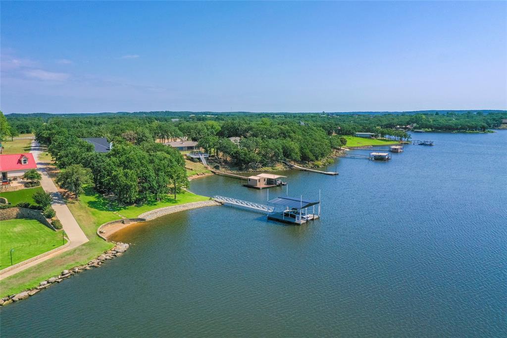 1757 Country Club Road Bowie, TX 76230 - Photo 40 of 40 a view of a lake with lawn chairs