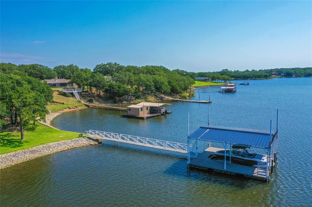 1757 Country Club Road Bowie, TX 76230 - Photo 5 of 40 an aerial view of a house with a lake view
