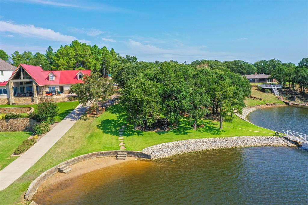 1757 Country Club Road Bowie, TX 76230 - Photo 7 of 40 a view of a swimming pool with a yard