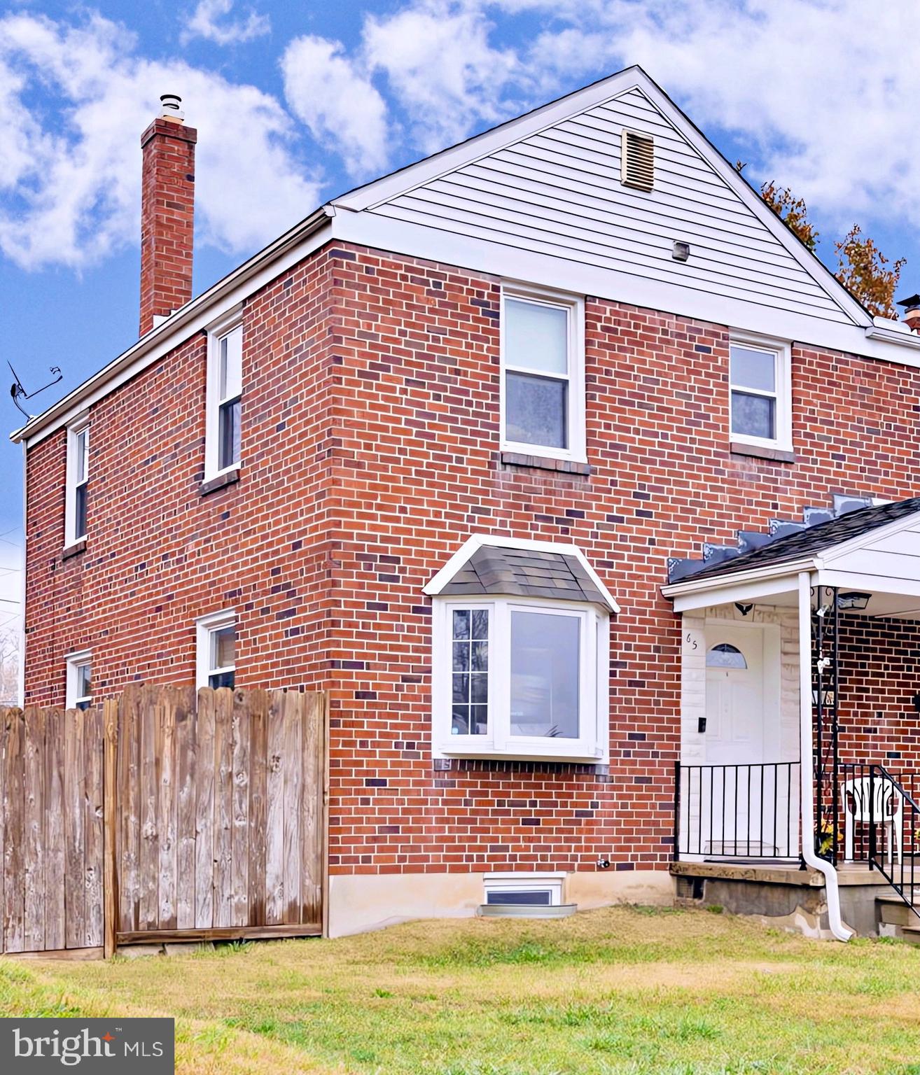 65 Garden Ridge Road Catonsville, MD 21228 - Photo 1 of 19 a front view of a house with a yard