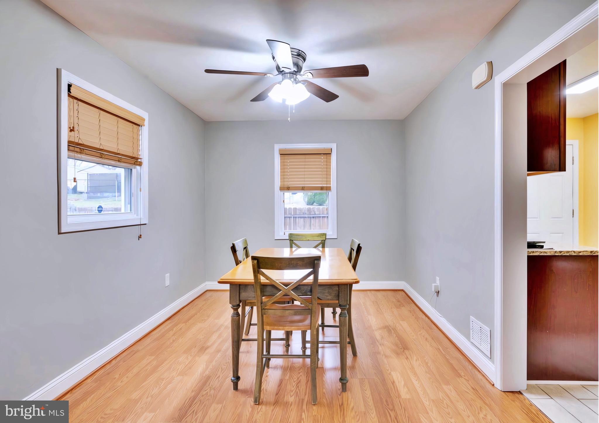 65 Garden Ridge Road Catonsville, MD 21228 - Photo 5 of 19 a workspace with wooden floor and a window