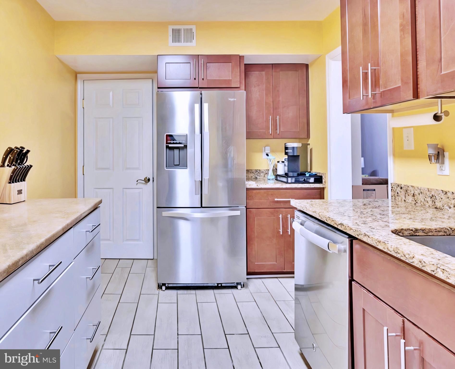 65 Garden Ridge Road Catonsville, MD 21228 - Photo 8 of 19 a kitchen with a refrigerator sink and cabinets