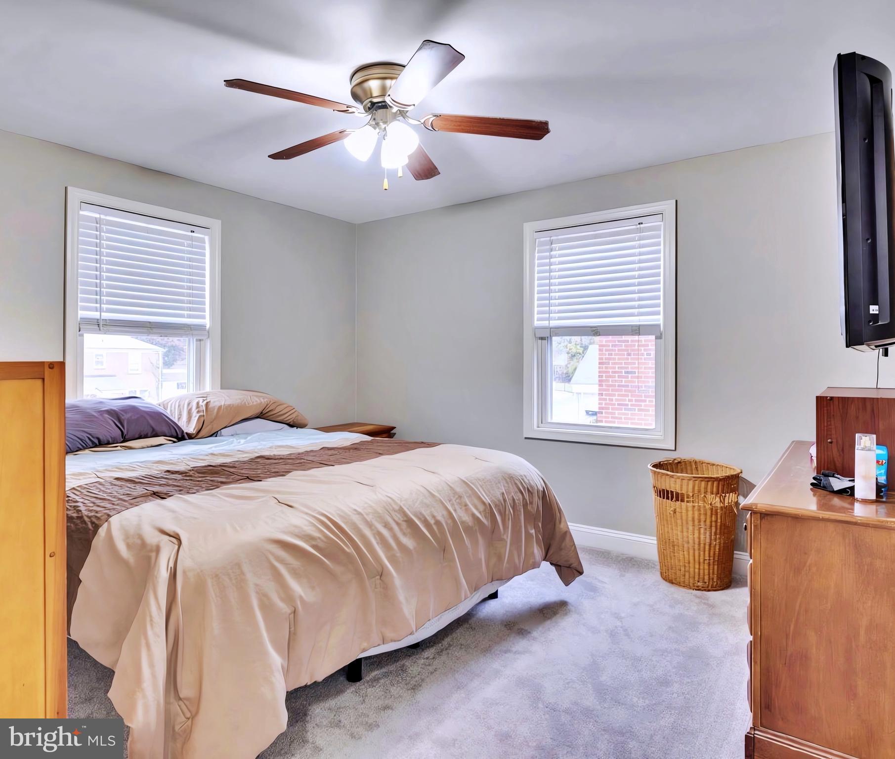 65 Garden Ridge Road Catonsville, MD 21228 - Photo 9 of 19 a bedroom with a bed and a chandelier