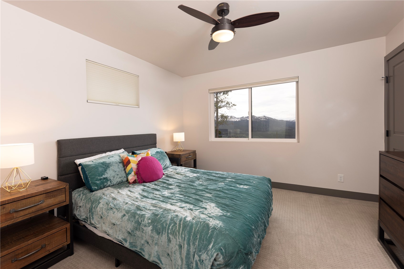 260 Fuller Placer Road Breckenridge, CO 80424 - Photo 20 of 32 a bedroom with a bed and window