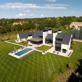 a view of a swimming pool with lounge chairs in patio