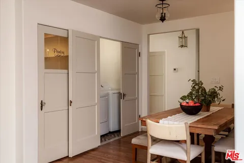 a dining room with furniture and wooden floor