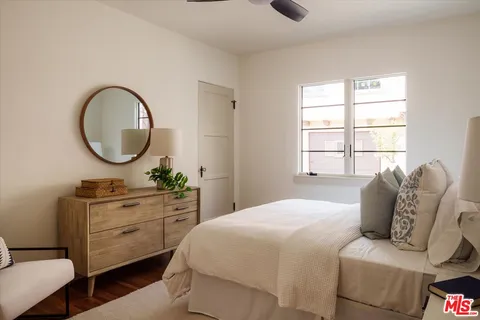 a bedroom with a bed and a dresser