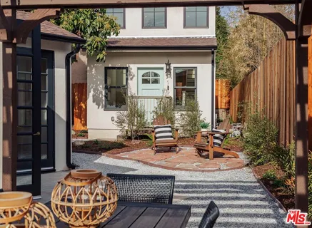 a view of a chairs and table in a patio