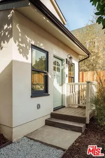 a front view of a house with stairs