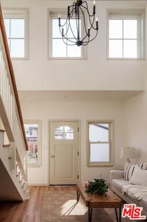 a living room with furniture and windows