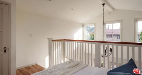 a view of a hallway with windows