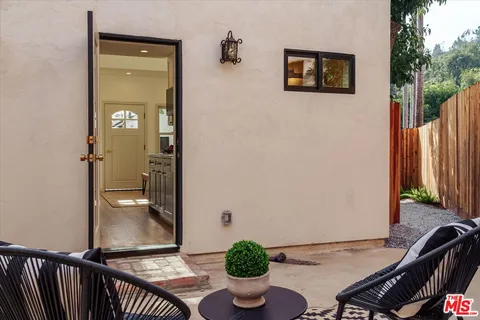 a view of a hallway with dining area