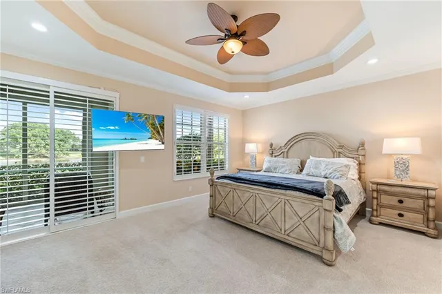 a bedroom with a bed next to a window