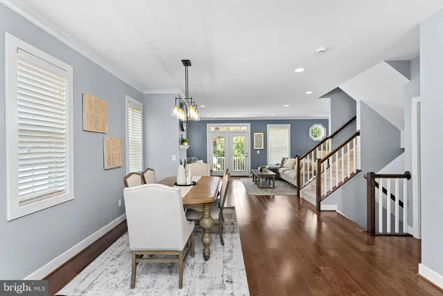 a kitchen with appliances a sink a counter top space and stainless steel appliances