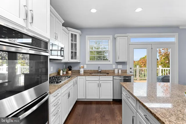 a bathroom with a glass shower door and a window