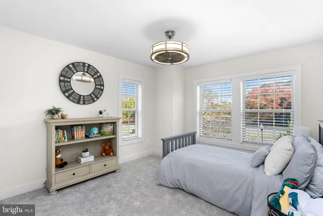 a view of a patio with couches and a fireplace with wooden floor
