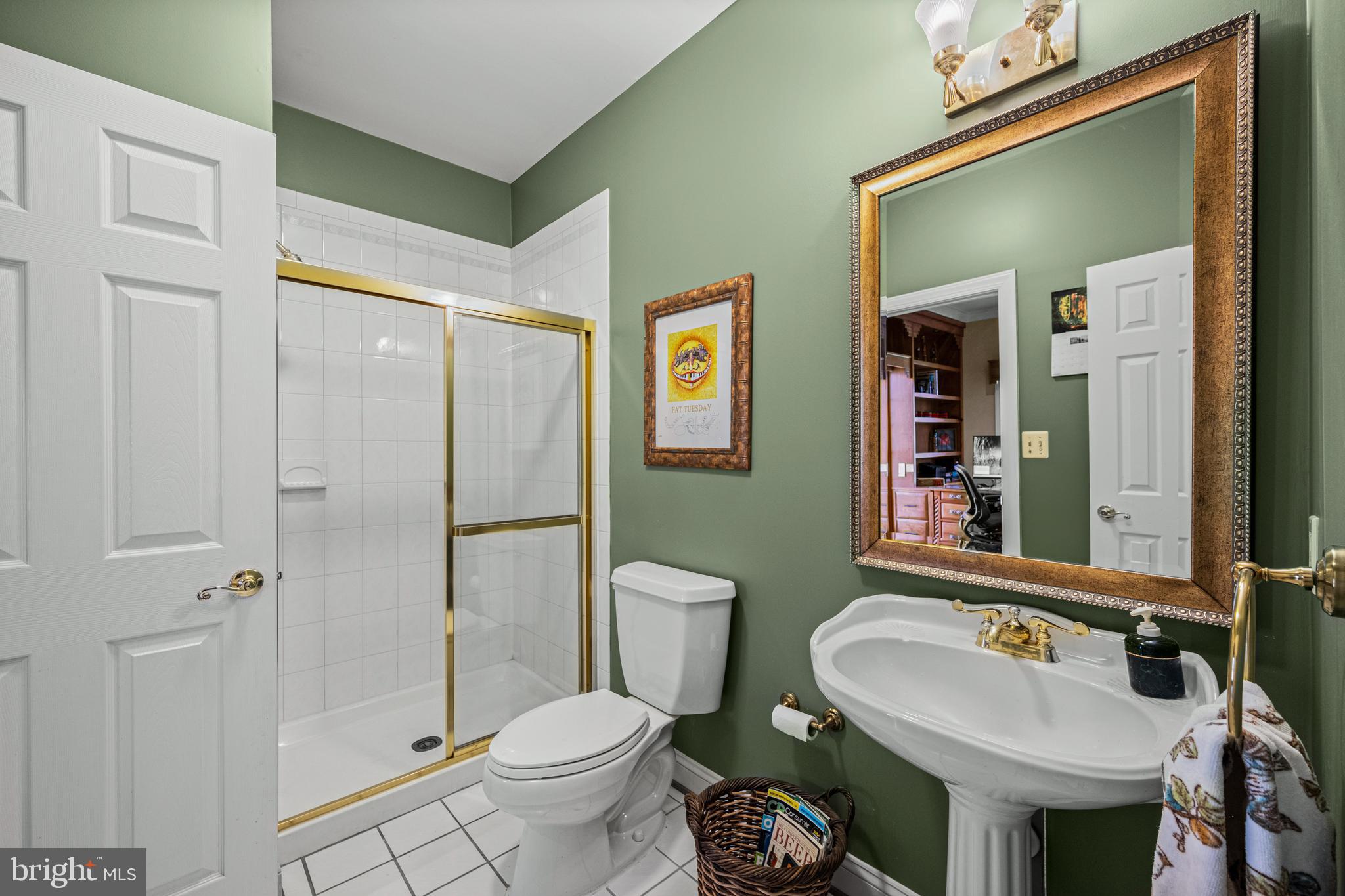 1206 Crystal Ridge Road Marriottsville, MD 21104 - Photo 18 of 72 a bathroom with a sink toilet and shower