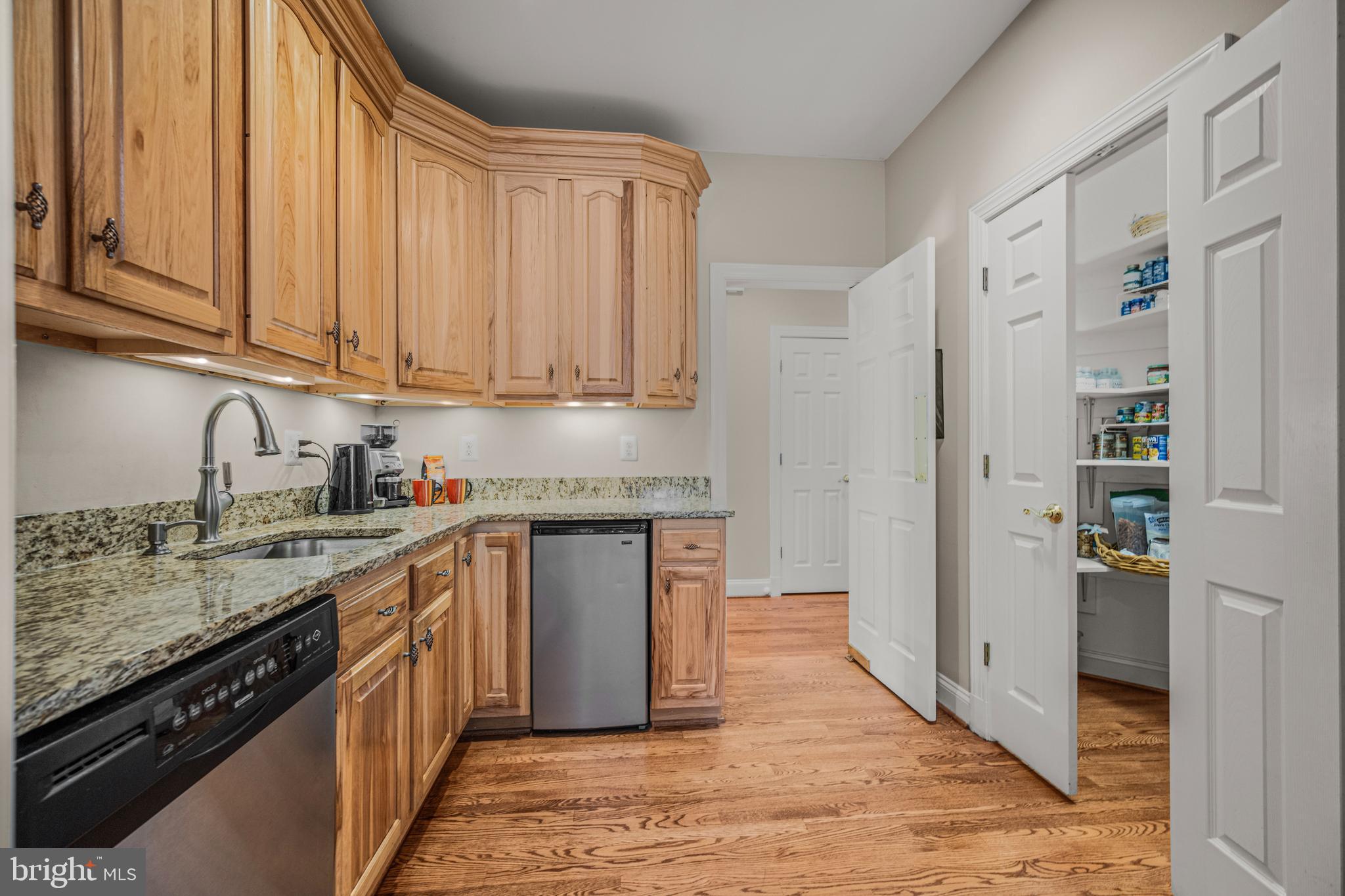 1206 Crystal Ridge Road Marriottsville, MD 21104 - Photo 33 of 72 a kitchen with stainless steel appliances granite countertop a refrigerator sink and cabinets