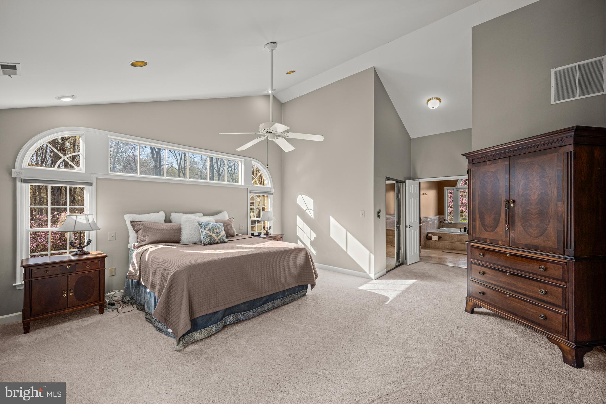 1206 Crystal Ridge Road Marriottsville, MD 21104 - Photo 36 of 72 a bedroom with a bed a chandelier and dresser