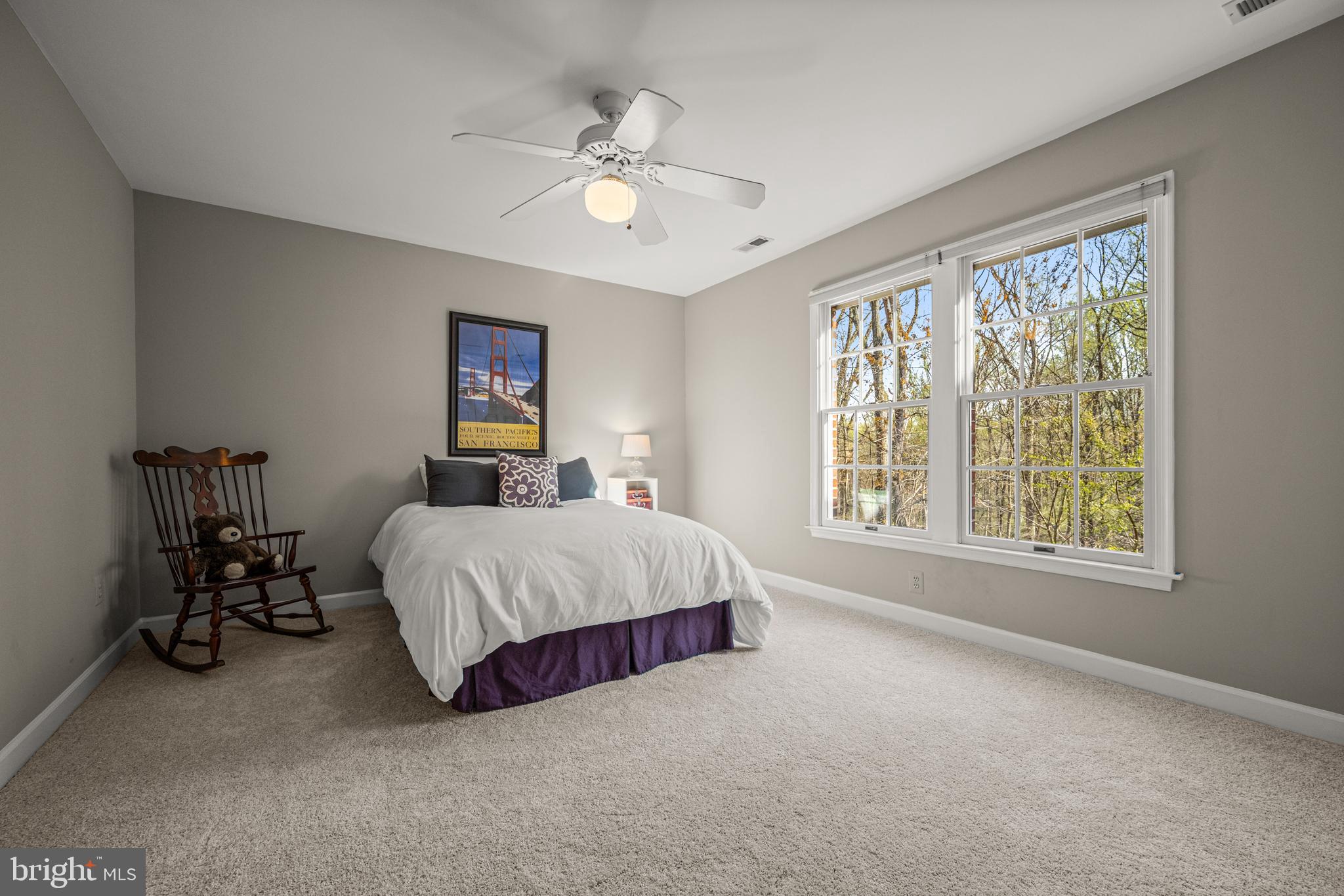 1206 Crystal Ridge Road Marriottsville, MD 21104 - Photo 46 of 72 a spacious bedroom with a large bed and a chandelier
