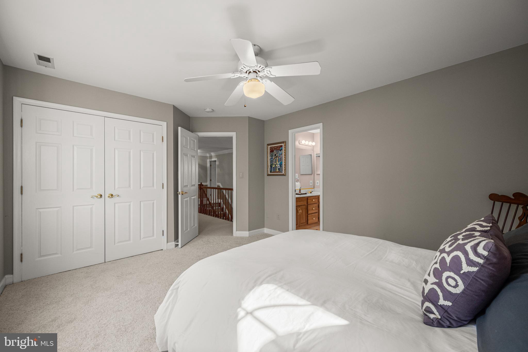 1206 Crystal Ridge Road Marriottsville, MD 21104 - Photo 47 of 72 a bedroom with a bed and a chandelier