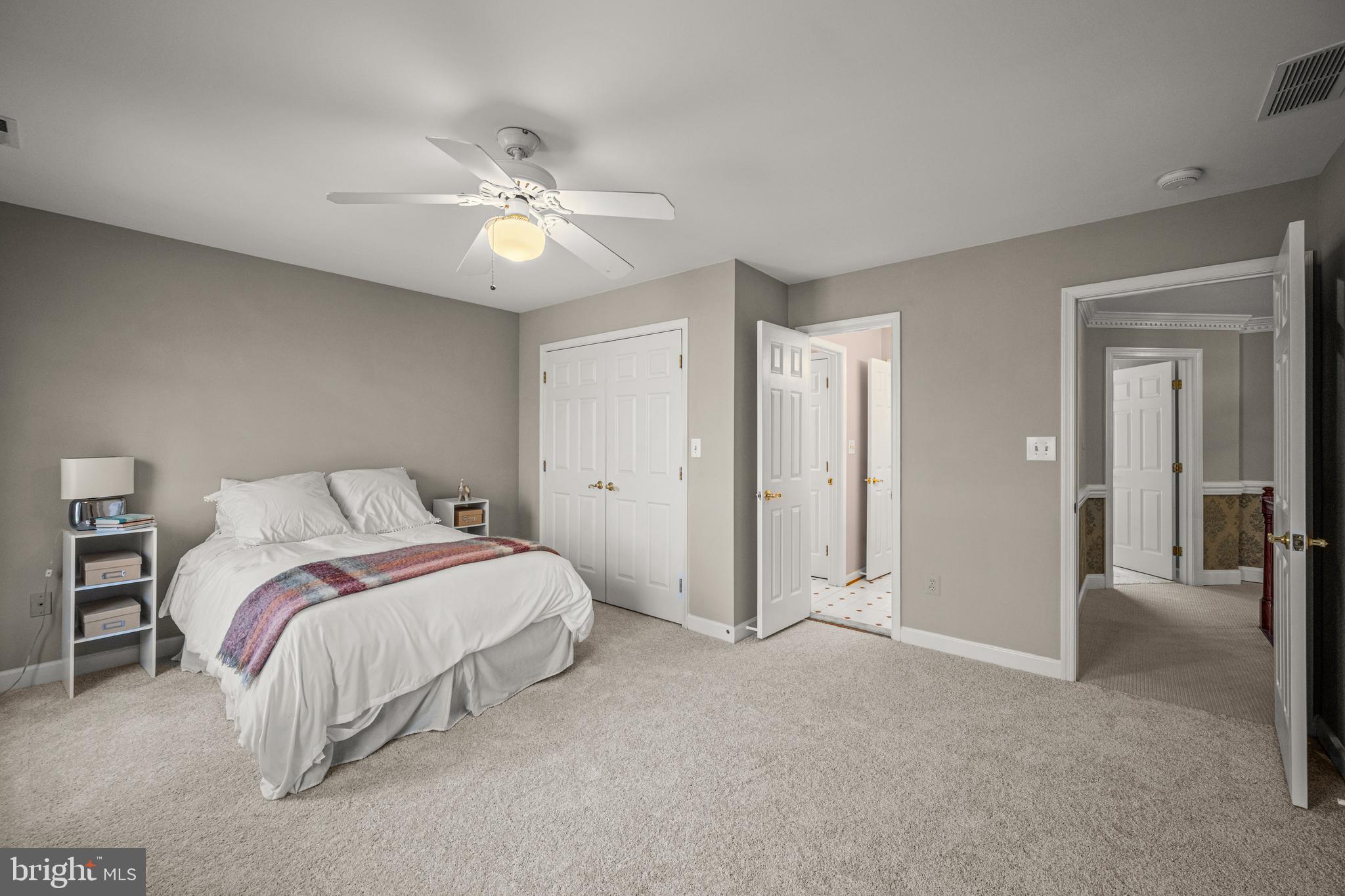 1206 Crystal Ridge Road Marriottsville, MD 21104 - Photo 49 of 72 a spacious bedroom with a bed and a chandelier