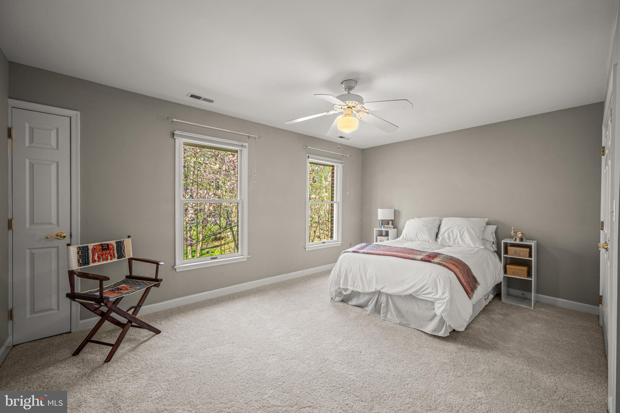 1206 Crystal Ridge Road Marriottsville, MD 21104 - Photo 50 of 72 a spacious bedroom with a bed a chair and a window