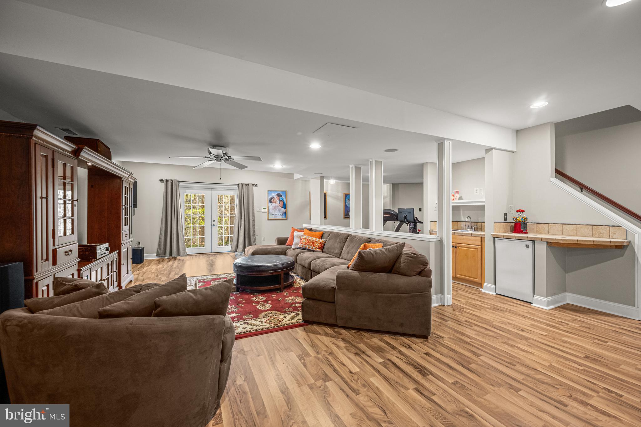1206 Crystal Ridge Road Marriottsville, MD 21104 - Photo 51 of 72 a living room with furniture and a wooden floor
