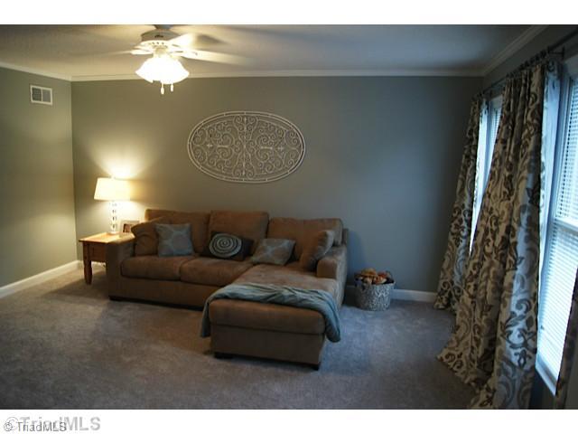 118 Raintree Road Advance, NC 27006 - Photo 4 of 16 Living Room. Large room with new carpet.