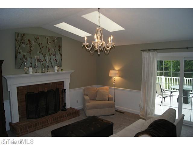 118 Raintree Road Advance, NC 27006 - Photo 5 of 16 Den/Family/Great Room. Den with fireplace, skylights,new paint and carpet plus door to deck.