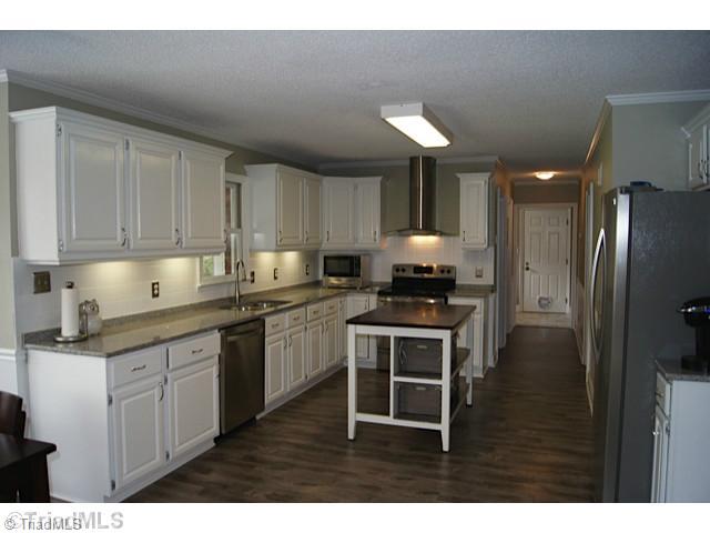 118 Raintree Road Advance, NC 27006 - Photo 7 of 16 Kitchen. Updated Kitchen flooring,lighting,counter tops and stainless steel appliances.