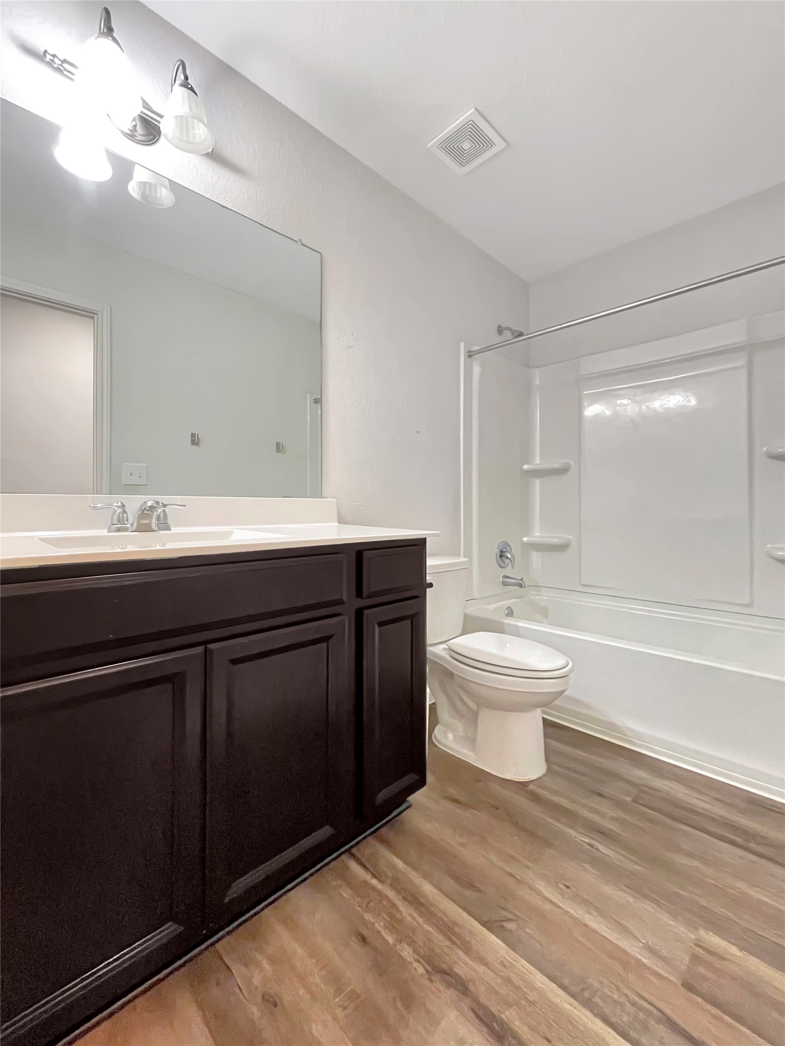 19221 Nathan Scott Way Manor, TX 78653 - Photo 12 of 15 a bathroom with a sink a toilet and bathtub