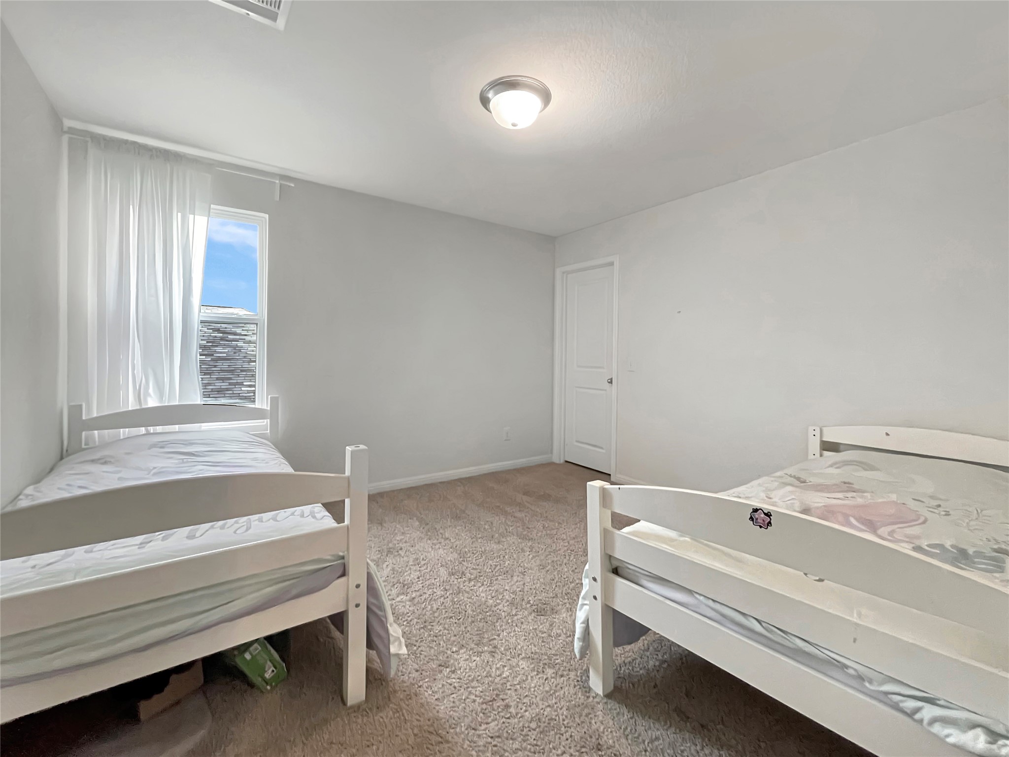 19221 Nathan Scott Way Manor, TX 78653 - Photo 13 of 15 a bathroom with a bathtub and a window