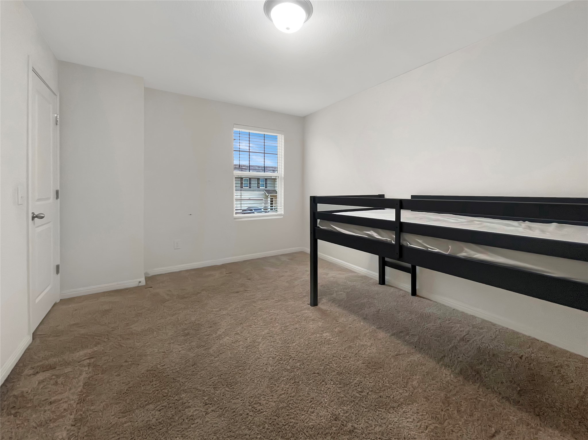 19221 Nathan Scott Way Manor, TX 78653 - Photo 14 of 15 a view of an empty room with a window