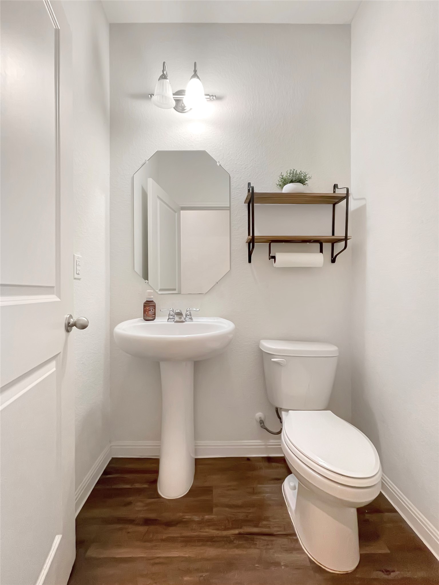 19221 Nathan Scott Way Manor, TX 78653 - Photo 4 of 15 a bathroom with a sink toilet and mirror