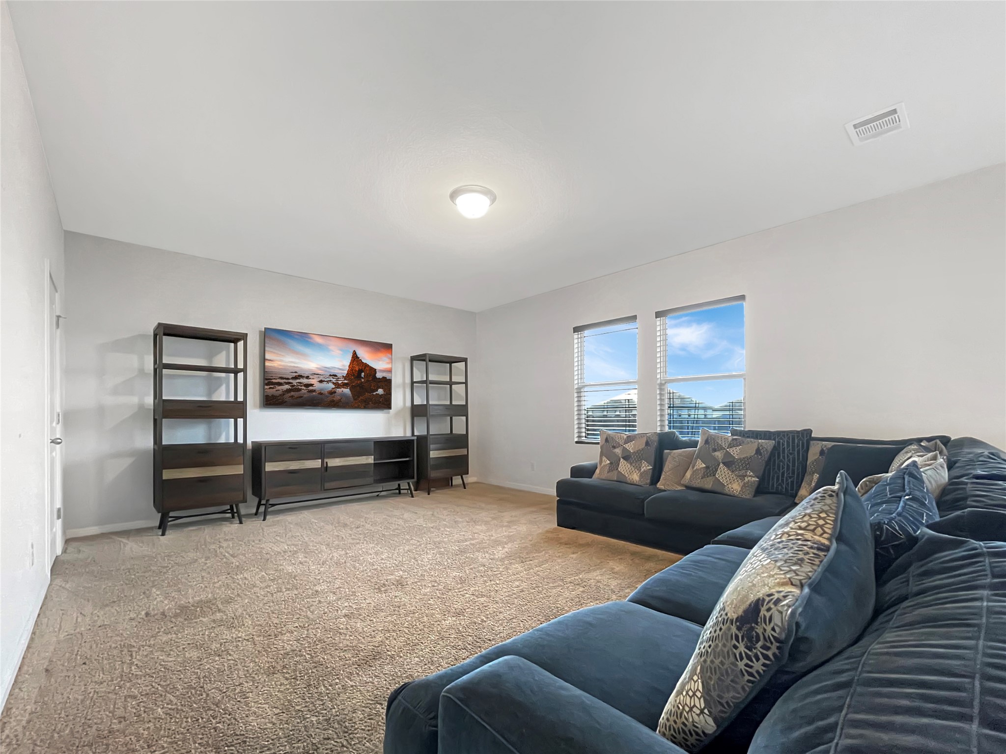 19221 Nathan Scott Way Manor, TX 78653 - Photo 8 of 15 a living room with furniture and a flat screen tv