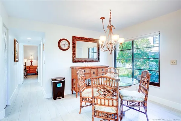 a view of a chairs and table in a room