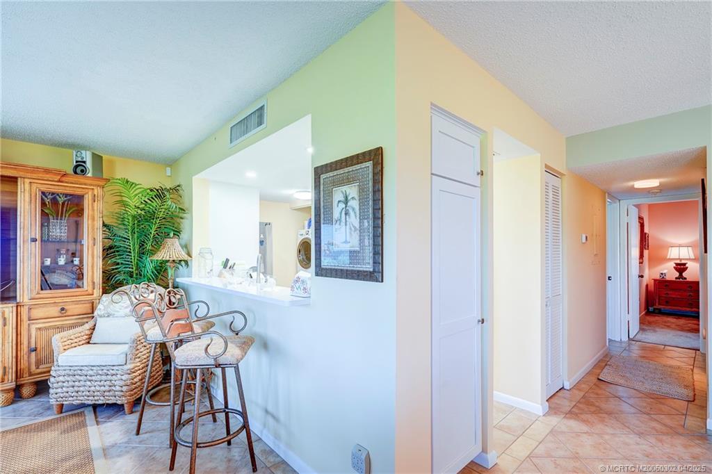 331 Golfview Circle Stuart, FL 34996 - Photo 13 of 39 a view of a livingroom with furniture window and wooden floor